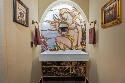 a bathroom with a sink and a mirror at Harry Potter Stay Near Universal in Orlando