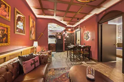 a living room with a couch and a table at Harry Potter Stay Near Universal in Orlando