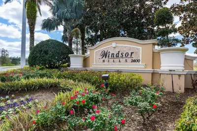 a sign for the windsor villas gardens at Palm Tree Paradise 3 bedroom condo at Windsor Hills close to Disney in Orlando