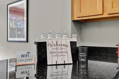 a group of bottles of water on a kitchen counter at Beautiful 3 Bedroom Villa with Private Hot Tub, 10 mins to Disney! in Kissimmee