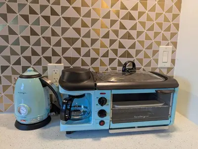 a toaster oven sitting on top of a counter at Serenity Spring Lake King Suite in Orlando