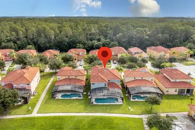 an aerial view of a residential estate with a red marker at 6BR Fun Villa – Game Room, Pool, Near Parks in Kissimmee