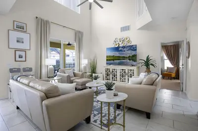 a living room with couches and tables at Luxurious Family Resort Getaway in Kissimmee