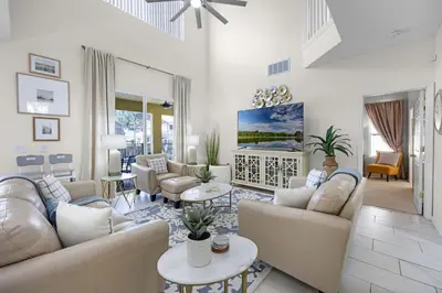 a living room with couches and tables at Luxurious Family Resort Getaway in Kissimmee