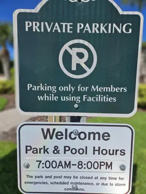 a parking sign for a parking only for members while using facilities at Magical Getaway- Cozy Home Minutes from Disney, Restaurants & Outlets! in Kissimmee