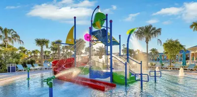 a water park with a slide in the water at Brand New 05 Bedrooms At Windsor Cay in Orlando