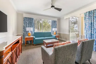 a living room with a couch and a tv at Hilton Vacation Club Cypress Pointe Orlando in Orlando