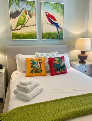 a bedroom with a bed with towels on it at Best Margaritaville Villa Near Disney World in Orlando