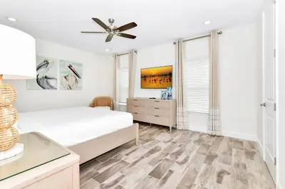 a bedroom with a bed and a ceiling fan at Best Margaritaville Villa Near Disney World in Orlando