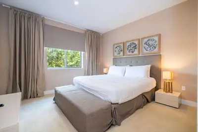 a bedroom with a large bed and a window at Modern Magic Village Home for 12 with Grill 3131 in Orlando