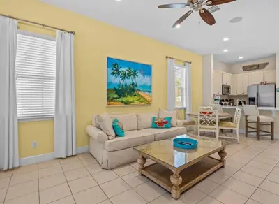 a living room with a couch and a table at Bikinis and Martinis - For 6 in Orlando