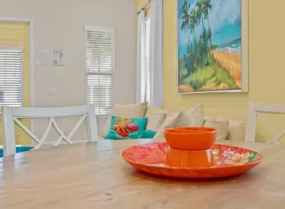 an orange plate on a table in a living room at Bikinis and Martinis - For 6 in Orlando