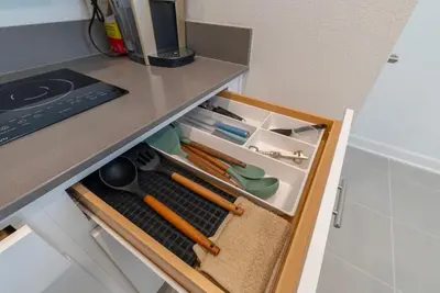 a drawer in a counter with some tools in it at Remote workers apartment or Long Stay Home