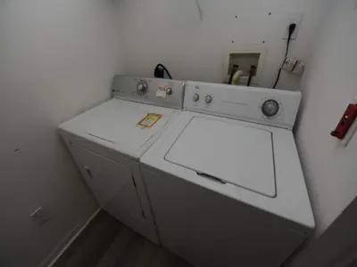 a white washing machine sitting in a room at Lake Therapy by Paradise Resort Vacations in Orlando