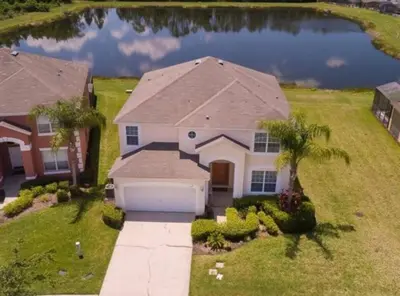 an aerial view of a house with a lake at Sunset Bliss Escape by Paradise Resort Vacations in Kissimmee