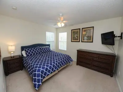 a bedroom with a bed and a ceiling fan at Sunshine Oasis Villa by Paradise Resort Vacations in Kissimmee