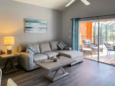 a living room with a couch and a table at Woodcrest Luxury by Paradise Resort Vacations in Orlando