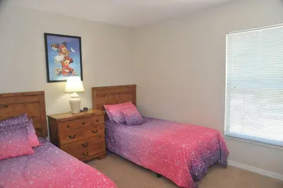 a bedroom with two beds and a window at Serenity Retreat Near Disney in Kissimmee