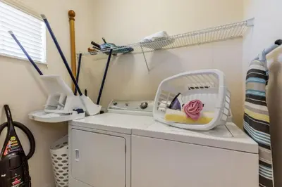 a washing machine with a basket on top of it at Three-Bedroom Apartment Kissimmee in Orlando