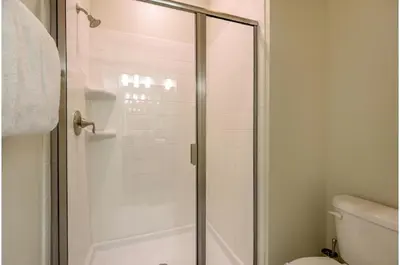 a shower stall in a bathroom with a toilet at Four-Bedroom Townhome Kissimmee in Orlando