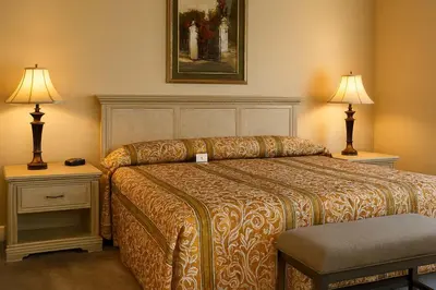 a hotel room with a bed and two lamps at Luxury 3-bed Condo Near Disney Worldquest Resort in Orlando