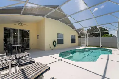 an indoor swimming pool with a glass ceiling at Near Disney Private Pool 4 Bedrooms in Kissimmee