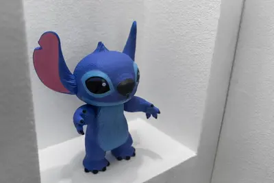 a blue stuffed animal is hanging on a wall at 4BD Family Pool Home, Near Disney & Workspace in Orlando