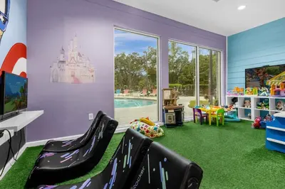 a childs play room with a castle on the wall at Family 3BR near Disney -4102 in Kissimmee