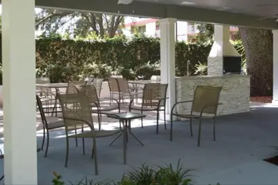 a group of chairs and tables on a patio at Family 3BR near Disney -4102 in Kissimmee