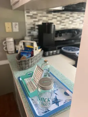 a counter top with a can of mack mixes at Cozy Private Cottage Only 5 miles from Disney in Kissimmee