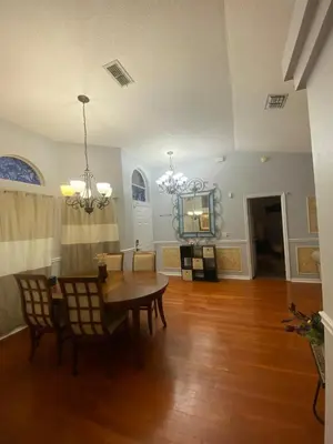 a dining room with a table and chairs at Orlando 4 bedroom Family Retreat in Orlando