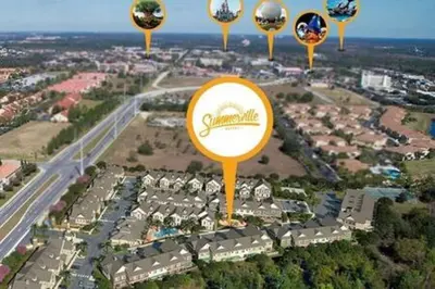 an aerial view of a parking lot with a sign at 4 Luxurious Suites Near Theme Parks and Downtown in Orlando
