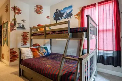 a bedroom with two bunk beds in a room at 4 Luxurious Suites Near Theme Parks and Downtown in Orlando
