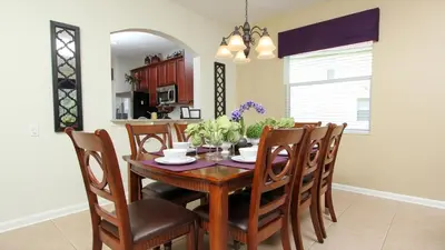 a dining room with a wooden table and chairs at Urban 6 Bed 4 Bath Villa- Perfect stay while exploring Orlando,Florida in Orlando