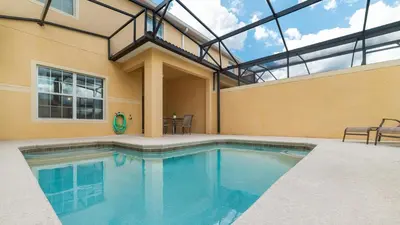 a swimming pool in a house with a glass ceiling at Private 4 Bed 3 Bath Townhome - Cozy family vacation home sleeps up to 10 guests in Kissimmee