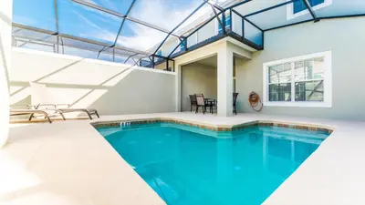 a swimming pool in a house with a glass ceiling at GRH9245 - Storey Lake Resort - 4 Bed 3 Baths Townhome in Kissimmee