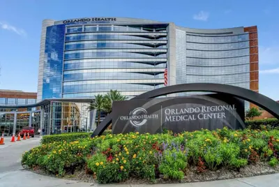 a sign for the ogilvy regional medical center in front of a building at Bungalow DT by Lake Eola KIA center Sleeps 12 in Orlando