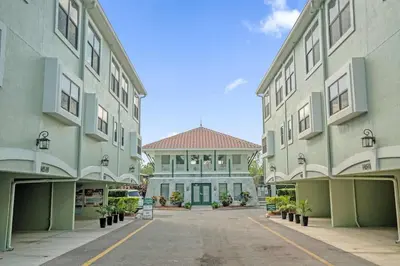 an empty parking lot in front of a building at Florida Summer - Townhome 5 min from Disney in Orlando