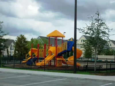 a playground with a slide in a park at Resort Bliss Near Disney Longer Stays Welcome in Kissimmee