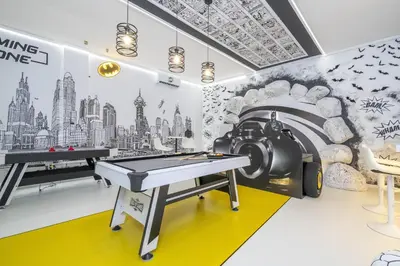 a gaming room with a ping pong table and a train mural at Disney Private Pool Game Room Themed Bedrooms. Book Now PG25 in Orlando