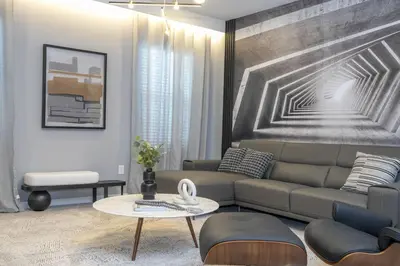 a living room with a couch and a table at Disney Private Pool Game Room Themed Bedrooms. Book Now PG25 in Orlando