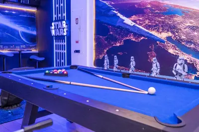 a billiard table in a room with at Disney Private Pool Game Room Themed Bedrooms. Book Now PG20 in Orlando