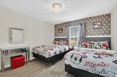 a bedroom with two beds with hello kitty sheets at Disney Getaway Private Pool Themed Bedrooms. Book Now SLR1162 in Kissimmee