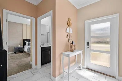 a room with a bathroom with a sink and a mirror at Disney Getaway Private Pool Themed Bedrooms. Book Now SLR411 in Kissimmee
