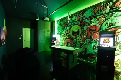 a room with a wall covered in graffiti at Disney Private Pool Hot Tub Game Room Themed Bedrooms. Book Now SLR497 in Kissimmee