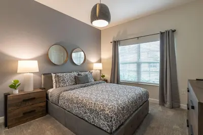 a bedroom with a bed and a window at Disney Getaway Private Pool Themed Bedrooms. Book Now SLR377 in Kissimmee