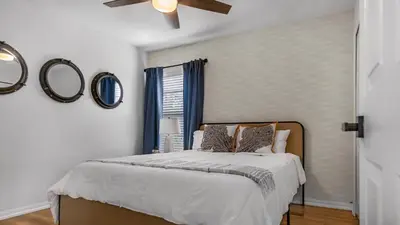 a bedroom with a bed and a ceiling fan at Disney Private Pool Hot Tub Game Room Themed Bedrooms. Book Now EIR179 in Kissimmee