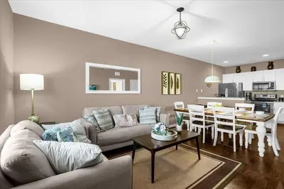 a living room with a couch and a table at Disney Getaway Townhouse with Private Pool. Book Now WLV82 in Kissimmee