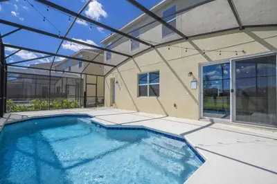 a swimming pool in a house with a glass ceiling at Disney Getaway Private Pool Themed Bedrooms. Book Now BV241 in Kissimmee