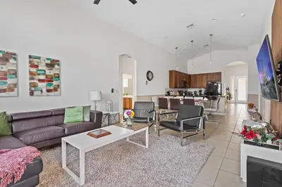 a living room with a couch and a table at Disney Getaway Private Pool Game Room. Book Now BV77 in Kissimmee